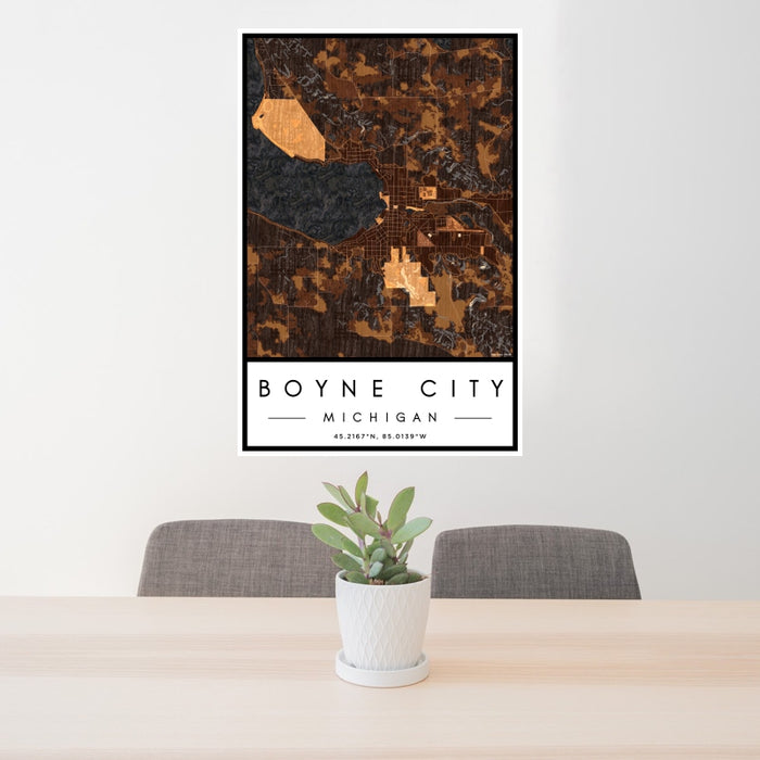 24x36 Boyne City Michigan Map Print Portrait Orientation in Ember Style Behind 2 Chairs Table and Potted Plant