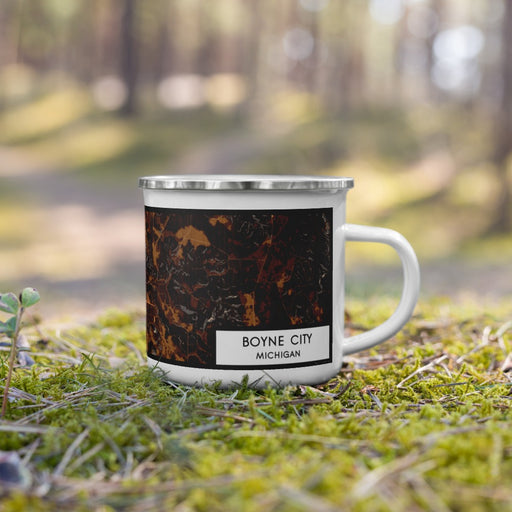 Right View Custom Boyne City Michigan Map Enamel Mug in Ember on Grass With Trees in Background