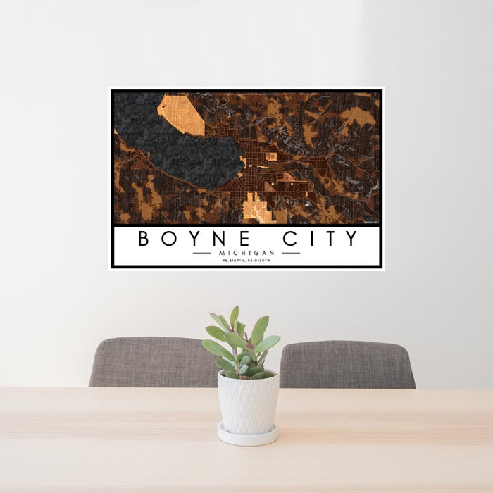 24x36 Boyne City Michigan Map Print Landscape Orientation in Ember Style Behind 2 Chairs Table and Potted Plant