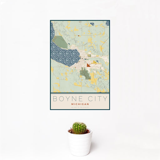 12x18 Boyne City Michigan Map Print Portrait Orientation in Woodblock Style With Small Cactus Plant in White Planter