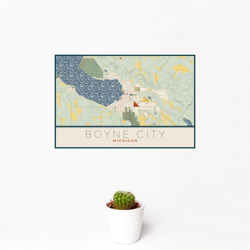 12x18 Boyne City Michigan Map Print Landscape Orientation in Woodblock Style With Small Cactus Plant in White Planter
