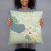 Person holding 18x18 Custom Boyne City Michigan Map Throw Pillow in Woodblock