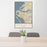 24x36 Bradenton Florida Map Print Portrait Orientation in Woodblock Style Behind 2 Chairs Table and Potted Plant
