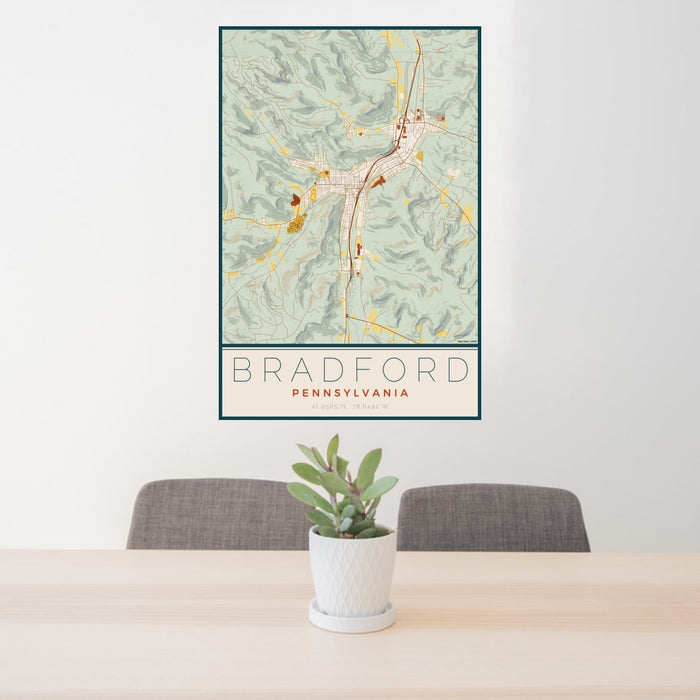 24x36 Bradford Pennsylvania Map Print Portrait Orientation in Woodblock Style Behind 2 Chairs Table and Potted Plant