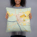 Person holding 18x18 Custom Branford Florida Map Throw Pillow in Woodblock