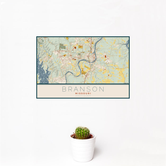 12x18 Branson Missouri Map Print Landscape Orientation in Woodblock Style With Small Cactus Plant in White Planter