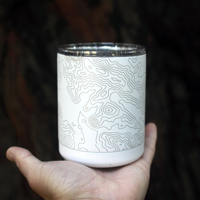 10oz Stainless Steel Insulated Cup in White with Custom Engraved Map Resting on Hand