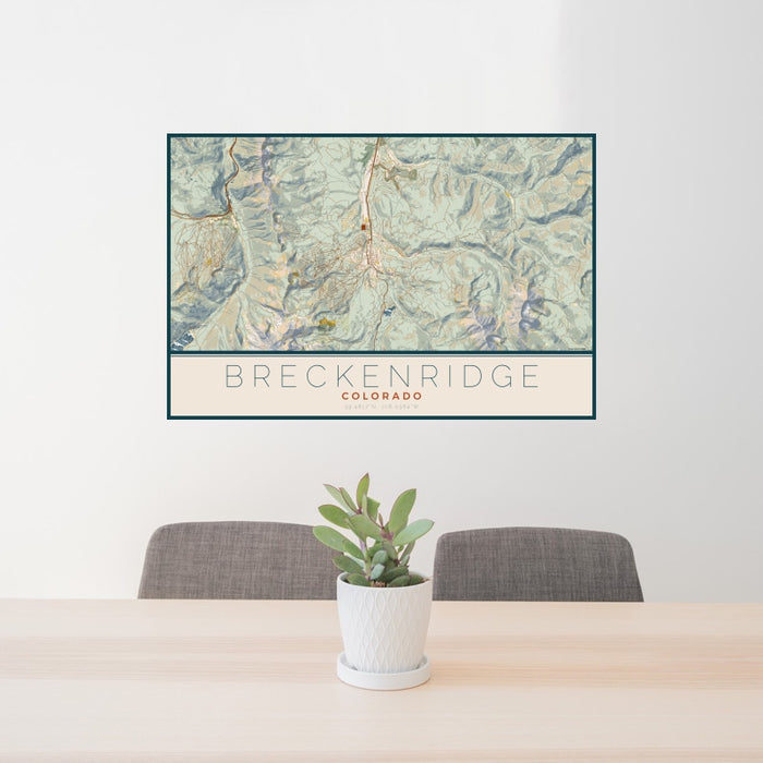 24x36 Breckenridge Colorado Map Print Landscape Orientation in Woodblock Style Behind 2 Chairs Table and Potted Plant