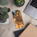 Custom Brentwood California Map Phone Case in Ember on Table with Laptop and Plant