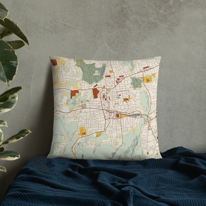 Custom Bristol Connecticut Map Throw Pillow in Woodblock on Bedding Against Wall