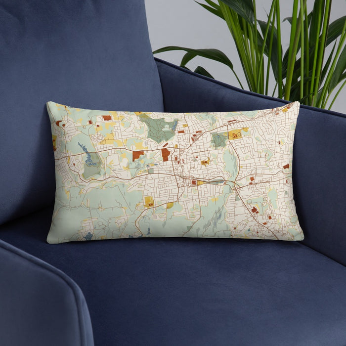 Custom Bristol Connecticut Map Throw Pillow in Woodblock on Blue Colored Chair