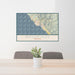 24x36 Brookings Oregon Map Print Lanscape Orientation in Woodblock Style Behind 2 Chairs Table and Potted Plant