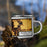 Right View Custom Browns Lake Wisconsin Map Enamel Mug in Ember on Grass With Trees in Background
