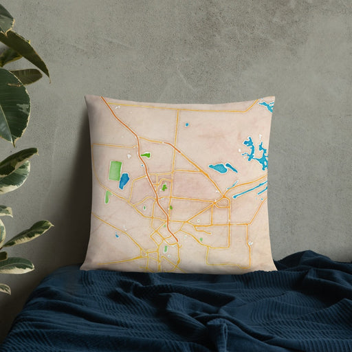 Custom Brownsville Texas Map Throw Pillow in Watercolor on Bedding Against Wall