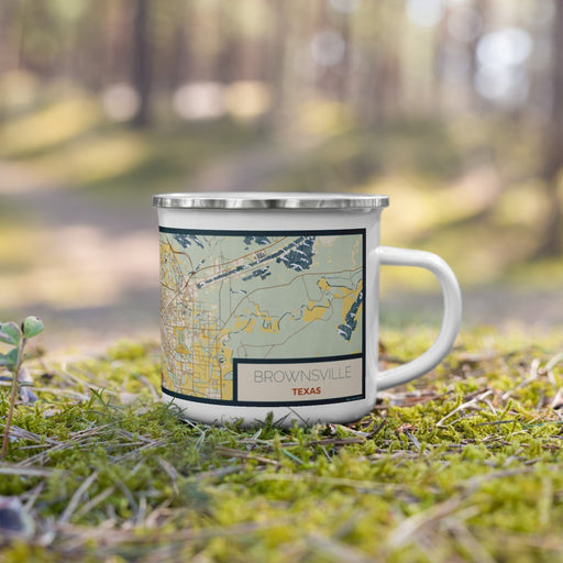 Right View Custom Brownsville Texas Map Enamel Mug in Woodblock on Grass With Trees in Background