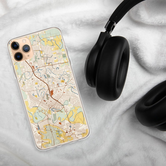Custom Brownsville Texas Map Phone Case in Woodblock on Table with Black Headphones