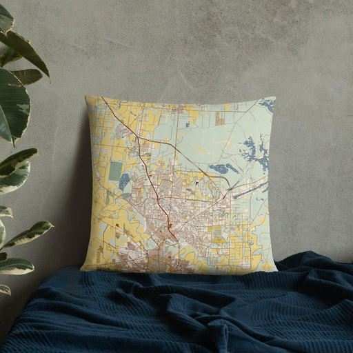 Custom Brownsville Texas Map Throw Pillow in Woodblock on Bedding Against Wall