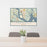 24x36 Brunswick Georgia Map Print Lanscape Orientation in Woodblock Style Behind 2 Chairs Table and Potted Plant