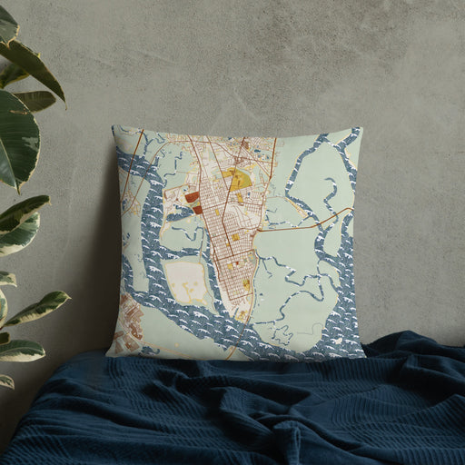 Custom Brunswick Georgia Map Throw Pillow in Woodblock on Bedding Against Wall