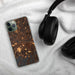 Custom Brunswick Maine Map Phone Case in Ember on Table with Black Headphones