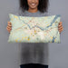 Person holding 20x12 Custom Brunswick Maine Map Throw Pillow in Woodblock