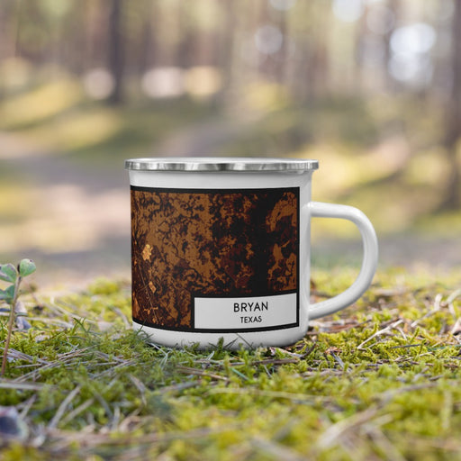 Right View Custom Bryan Texas Map Enamel Mug in Ember on Grass With Trees in Background