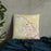 Custom Bryan Texas Map Throw Pillow in Woodblock on Bedding Against Wall