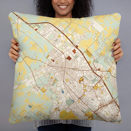 Person holding 22x22 Custom Bryan Texas Map Throw Pillow in Woodblock