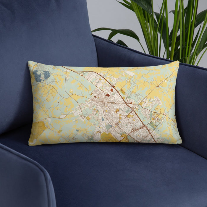 Custom Bryan Texas Map Throw Pillow in Woodblock on Blue Colored Chair