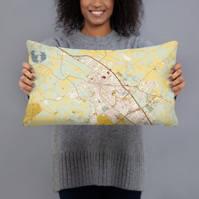 Person holding 20x12 Custom Bryan Texas Map Throw Pillow in Woodblock