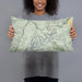 Person holding 20x12 Custom Bryce Canyon National Park Map Throw Pillow in Woodblock