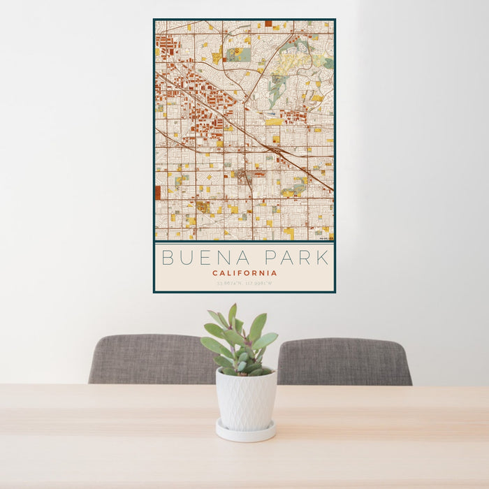 24x36 Buena Park California Map Print Portrait Orientation in Woodblock Style Behind 2 Chairs Table and Potted Plant