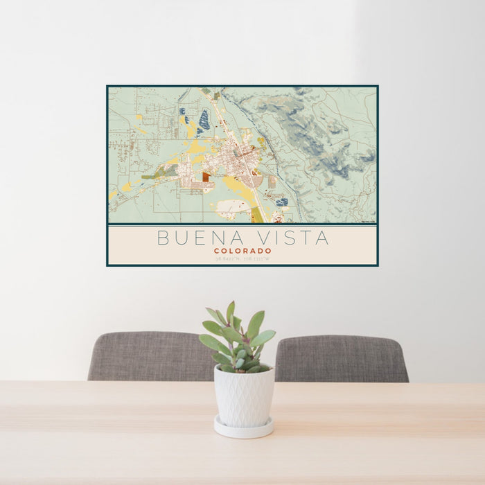 24x36 Buena Vista Colorado Map Print Lanscape Orientation in Woodblock Style Behind 2 Chairs Table and Potted Plant