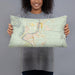 Person holding 20x12 Custom Bullhead City Arizona Map Throw Pillow in Woodblock