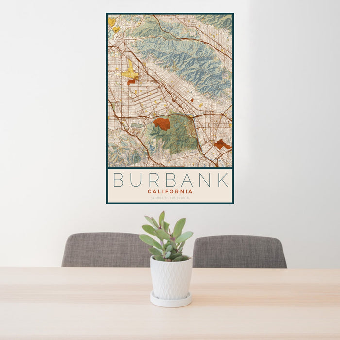 24x36 Burbank California Map Print Portrait Orientation in Woodblock Style Behind 2 Chairs Table and Potted Plant