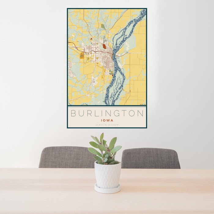 24x36 Burlington Iowa Map Print Portrait Orientation in Woodblock Style Behind 2 Chairs Table and Potted Plant