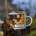 Right View Custom Burlington Wisconsin Map Enamel Mug in Ember on Grass With Trees in Background