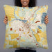 Person holding 22x22 Custom Burlington Wisconsin Map Throw Pillow in Woodblock