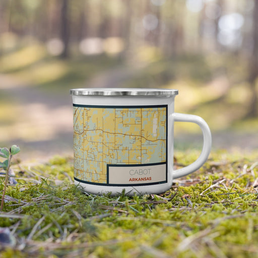 Right View Custom Cabot Arkansas Map Enamel Mug in Woodblock on Grass With Trees in Background