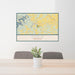 24x36 Cadiz Kentucky Map Print Lanscape Orientation in Woodblock Style Behind 2 Chairs Table and Potted Plant