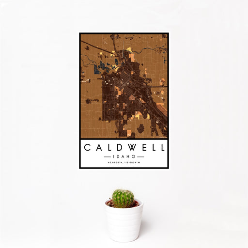 12x18 Caldwell Idaho Map Print Portrait Orientation in Ember Style With Small Cactus Plant in White Planter