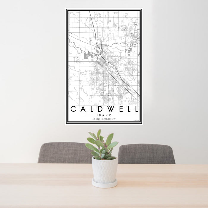 24x36 Caldwell Idaho Map Print Portrait Orientation in Classic Style Behind 2 Chairs Table and Potted Plant