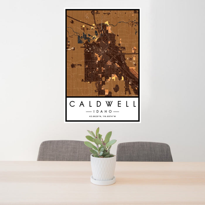 24x36 Caldwell Idaho Map Print Portrait Orientation in Ember Style Behind 2 Chairs Table and Potted Plant