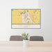 24x36 Caldwell Idaho Map Print Lanscape Orientation in Woodblock Style Behind 2 Chairs Table and Potted Plant