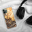 Custom Calistoga California Map Phone Case in Ember on Table with Black Headphones