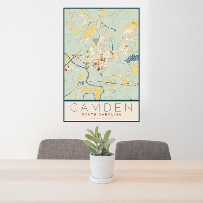 24x36 Camden South Carolina Map Print Portrait Orientation in Woodblock Style Behind 2 Chairs Table and Potted Plant