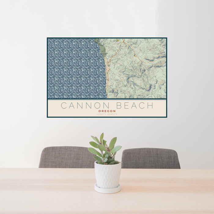 24x36 Cannon Beach Oregon Map Print Landscape Orientation in Woodblock Style Behind 2 Chairs Table and Potted Plant