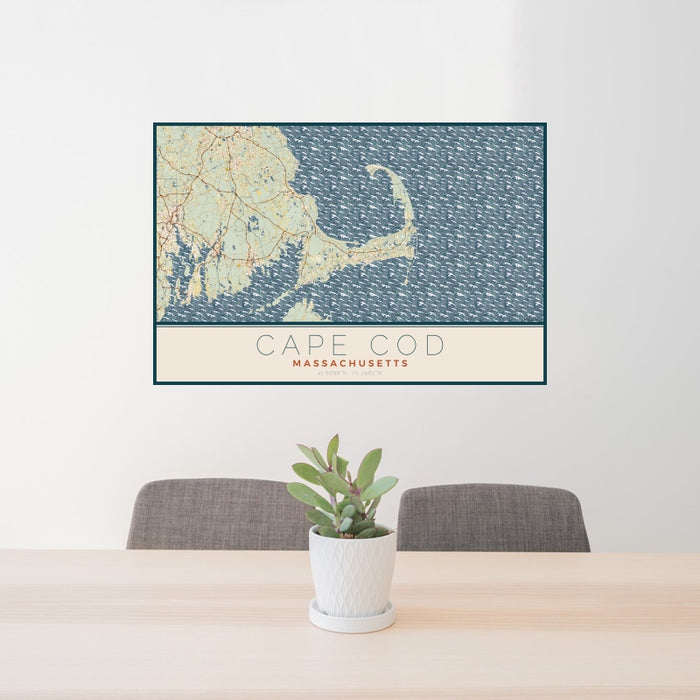 24x36 Cape Cod Massachusetts Map Print Landscape Orientation in Woodblock Style Behind 2 Chairs Table and Potted Plant