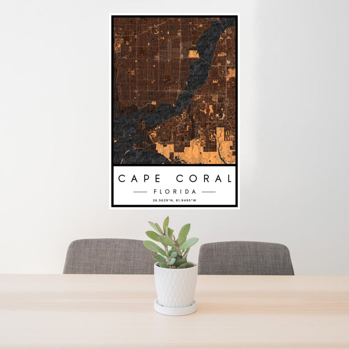 24x36 Cape Coral Florida Map Print Portrait Orientation in Ember Style Behind 2 Chairs Table and Potted Plant