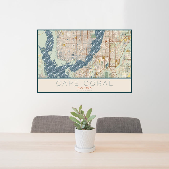 24x36 Cape Coral Florida Map Print Landscape Orientation in Woodblock Style Behind 2 Chairs Table and Potted Plant